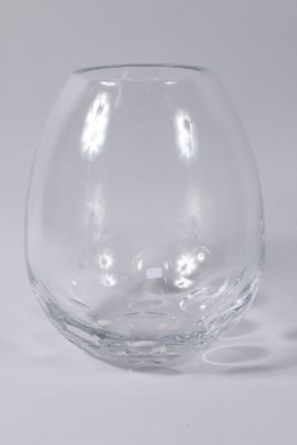 a glass vase that is sitting on a table