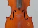 an old violin with a bow hanging from it ' s back