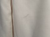 a close up of the back of a white jacket
