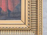 a painting of a woman in a red dress in a gold frame