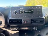 a car dashboard with a radio and a dash button