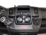 a dashboard of a vehicle with a steering wheel and gauges