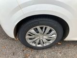 a close up of a car ' s tire on the pavement