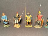 seven figurines of men dressed in medieval clothing