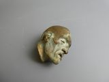 an image of a statue of a man ' s head with his eyes closed