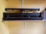 a shelf that has a bunch of tools on it