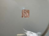 a white plate with a red and white design on it