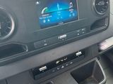 a car dashboard with a car radio and a steering wheel