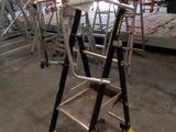 a ladder that is sitting in the middle of a room