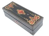 a black box with a red and gold design on it