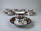 five cups and saucers sitting on a saucer