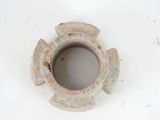 a small vase that is sitting on a white surface