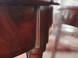 a close up of a wooden table with a glass top