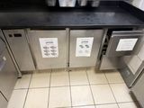 a picture of a commercial kitchen with stainless steel appliances