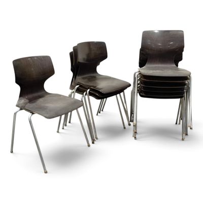 three black chairs sitting next to each other on a white surface