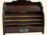 an image of a wooden desk organizer with a key on it