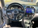 a dashboard of a car with a steering wheel and gauges