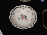a plate with flowers on it sitting on a table