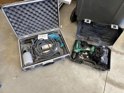 two tools in a case sitting on the floor