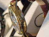a watch that is sitting in a box on the table