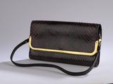 brown snake skin clutch bag with gold trim and strap