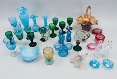 many different colored glass items on a white surface