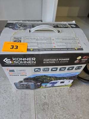 a box that is sitting on the floor next to a pair of shoes