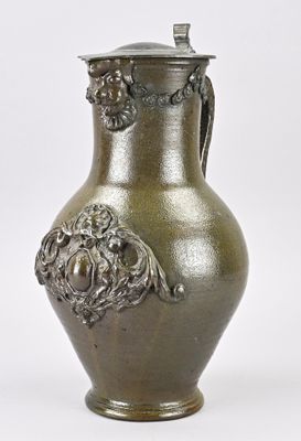 a silver vase with a lid on a white background