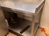 a kitchen with a sink and a stove in it