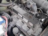 a car engine with a fan in the back of it