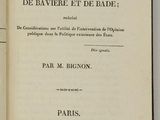 an open book with french text on it sitting on a table