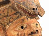 a wooden sculpture of two snakes on top of each other