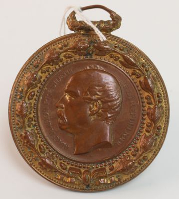 une image représentant une médaille de bronze sur laquelle figure la tête d'une femme