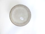 a white plate with a tag on it on a table