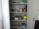 an image of a cluttered room with a computer and other items