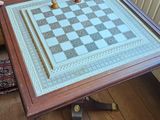 a chess board sitting on a table in a living room