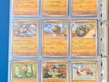 the inside of a blue binder holds a collection of pokemon cards