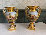 pair of antique hand painted porcelain vases on gold bases