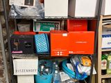 a shelf full of boxes and other items in a room
