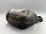 black leather fanny bag with white stitching on the side