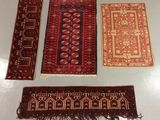 three oriental rugs on a table