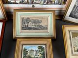 several framed pictures of various types of art on display in a room