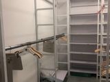 a closet with a ladder and a bed in it