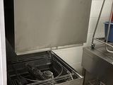 a kitchen with a sink, stove, and other appliances in it