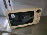 a toaster oven sitting on a counter in a kitchen