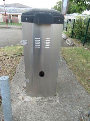 an image of a public toilet on a sidewalk