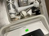a lot of items that are in a container on the counter