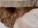 a close up of a wooden object on a table
