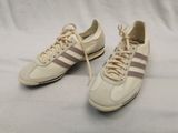 vintage adidas sneakers with pink and white stripes and laces
