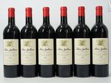 six bottles of red wine are lined up in a row